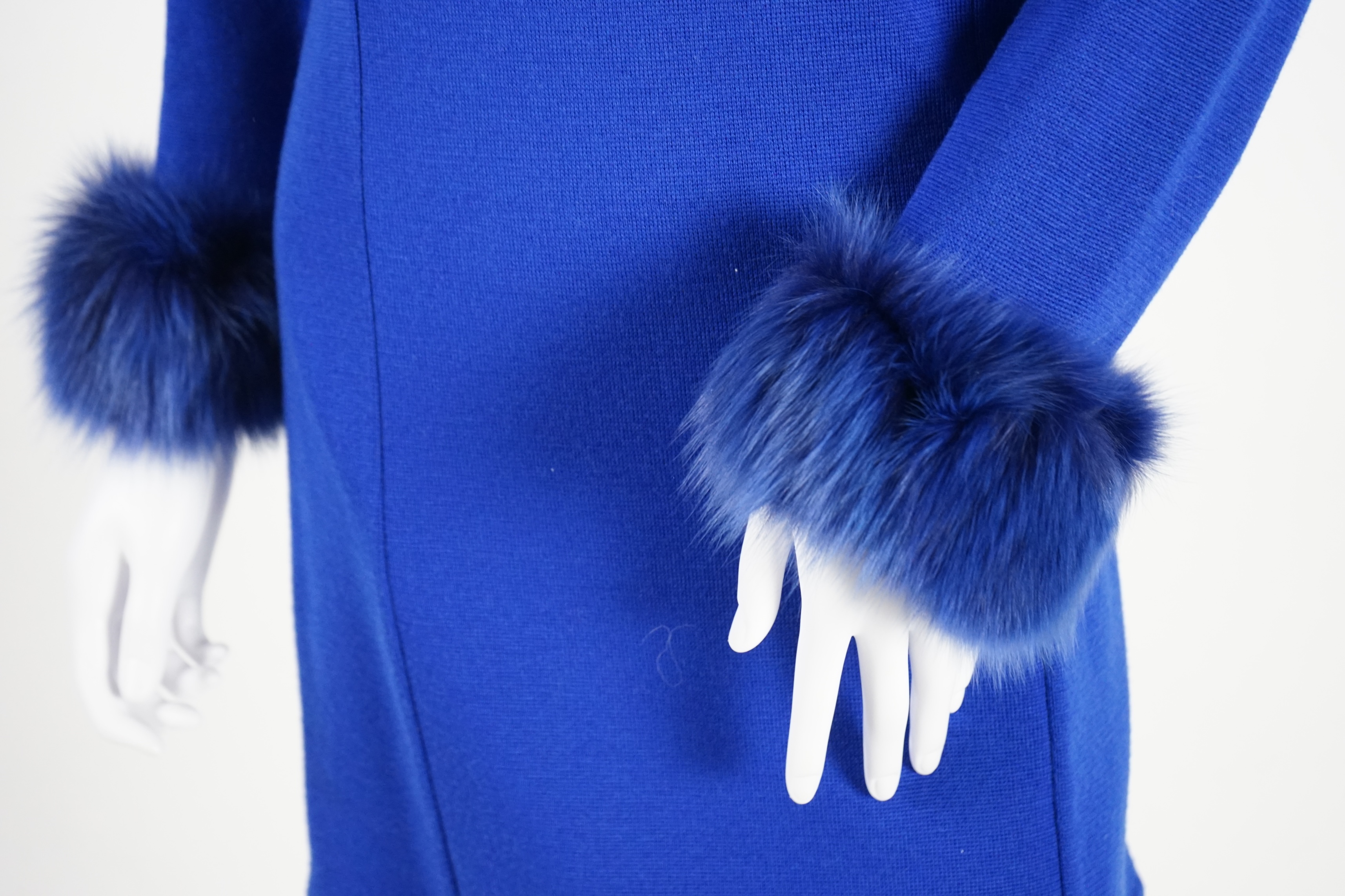 A Vera da Pozzo knitted royal blue suit with fur detail, knitted dress with fur cuffs and additional knitted skirt. Approx size 10-12 Proceeds to Happy Paws Puppy Rescue